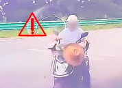 电动自行车逆行左转撞汽车 所幸男子佩戴头盔仅受擦伤