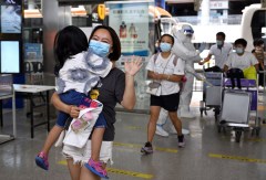 First group of tourists stranded in China's Sanya return home