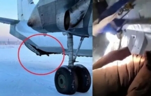 载25人俄飞机高空舱门突然打开 大部分行李被吸出机外 所幸飞机上无人受伤