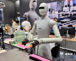 人形机器人进厂 效率只有人工3成 中美隔空比拼引发关注