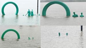 武汉江滩“一家五口”已“潜水”，雕塑静待水退