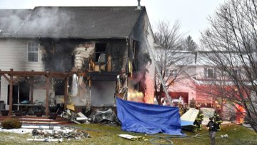Businessman and family die when plane hits Michigan house