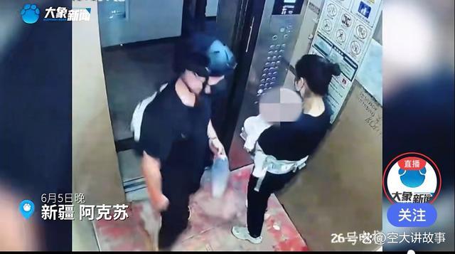电梯下坠时男子护住妻儿，确保他们安全