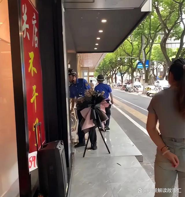 新店门口放花篮城管扎破气球引争议