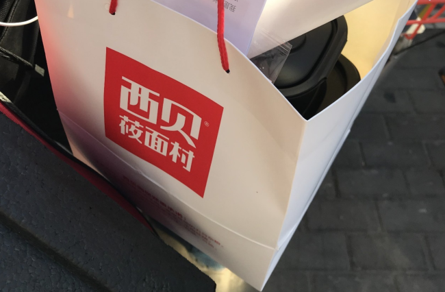 贾国龙和罗永浩谁先倒