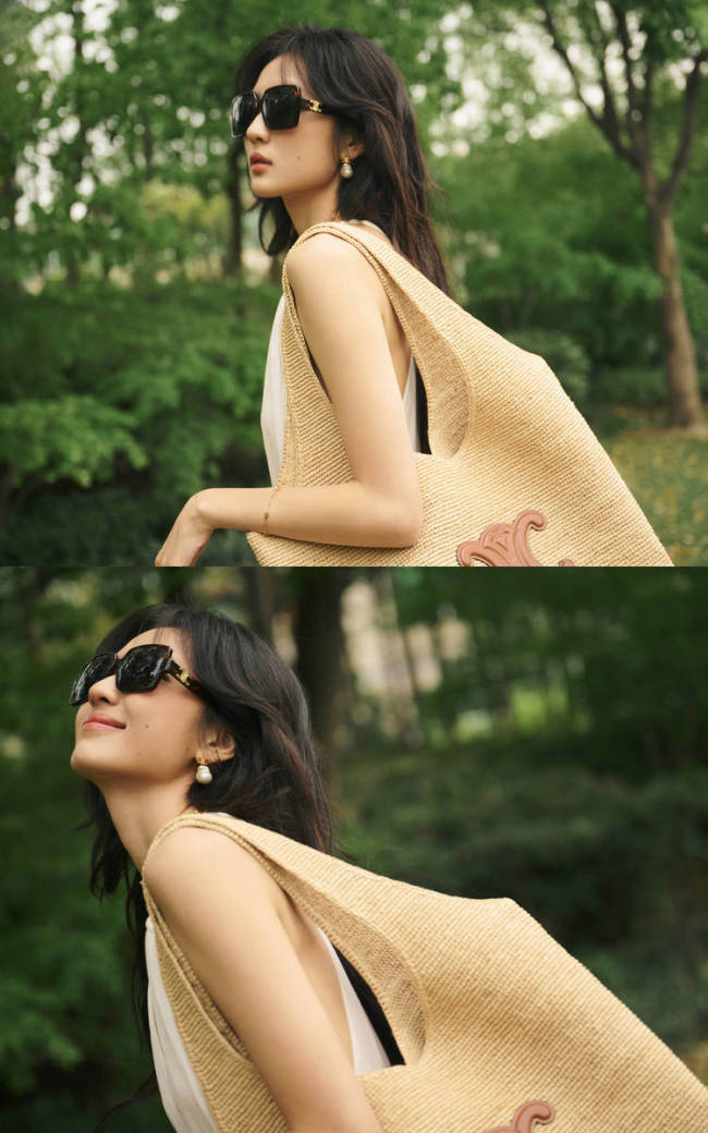 孙千穿白色吊带长裙清新温柔 阳光下笑容明媚灿烂