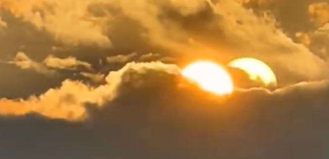男子拍到两个太阳藏在云层中 网友：怪不得这两天这么热