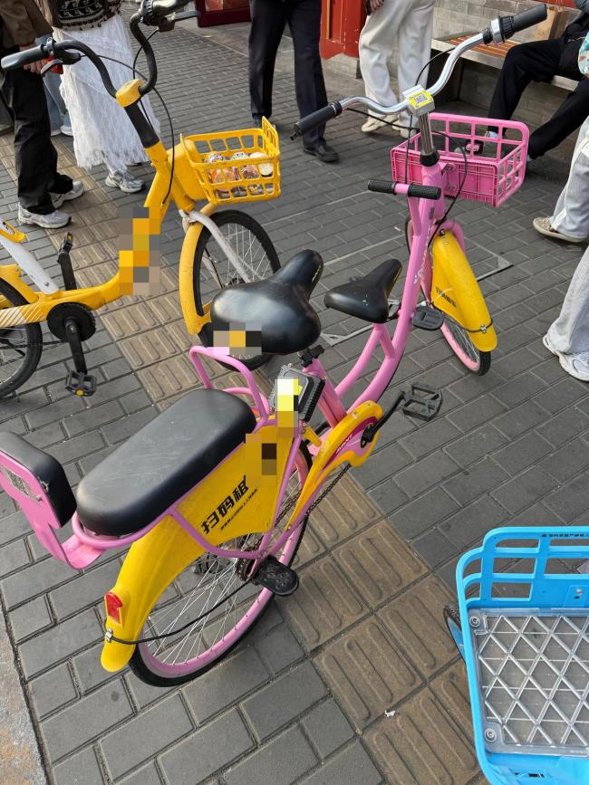 违规亲子共享单车再现：车从哪儿来